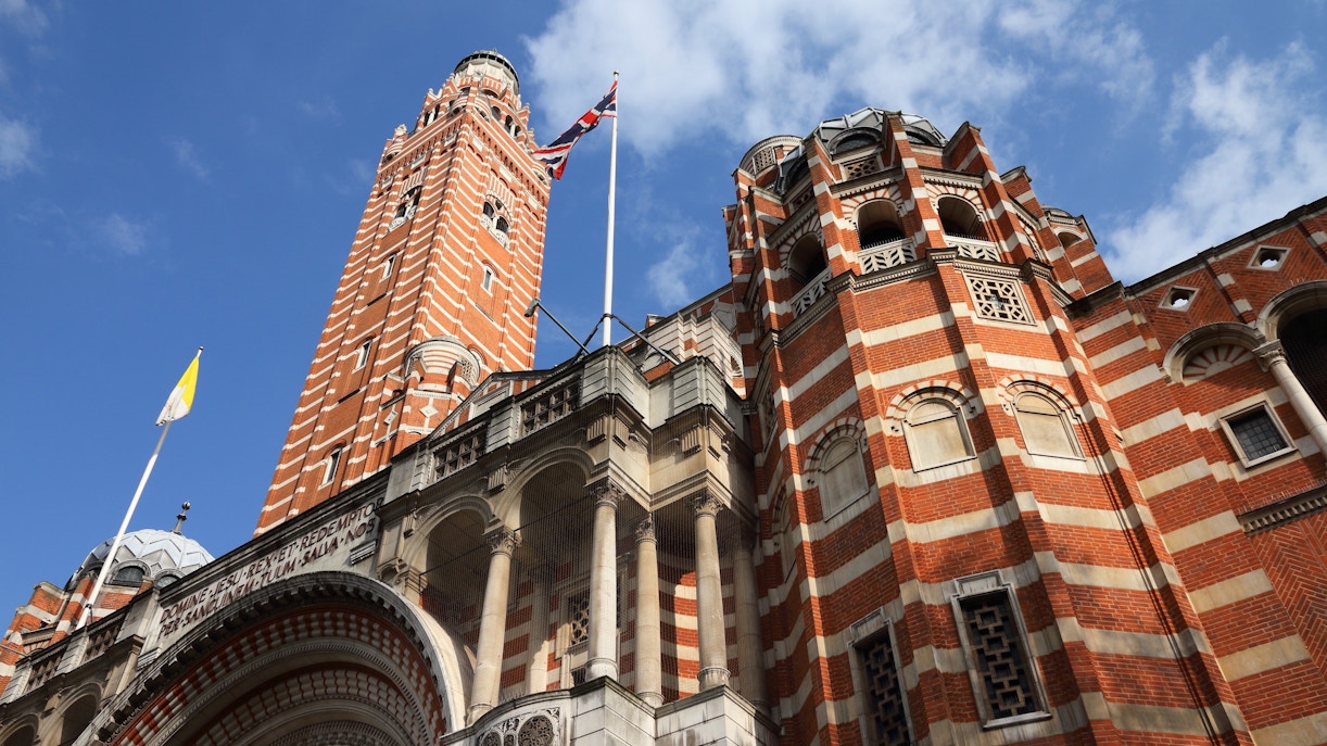 Westminster Cathedral's red brick facade and bell tower in London, UK.