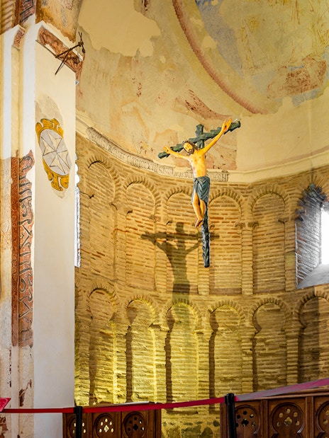 Mudejar-style apse with Holy Cross and faded frescos in Mosque of Cristo de la Luz, Toledo, Spain.