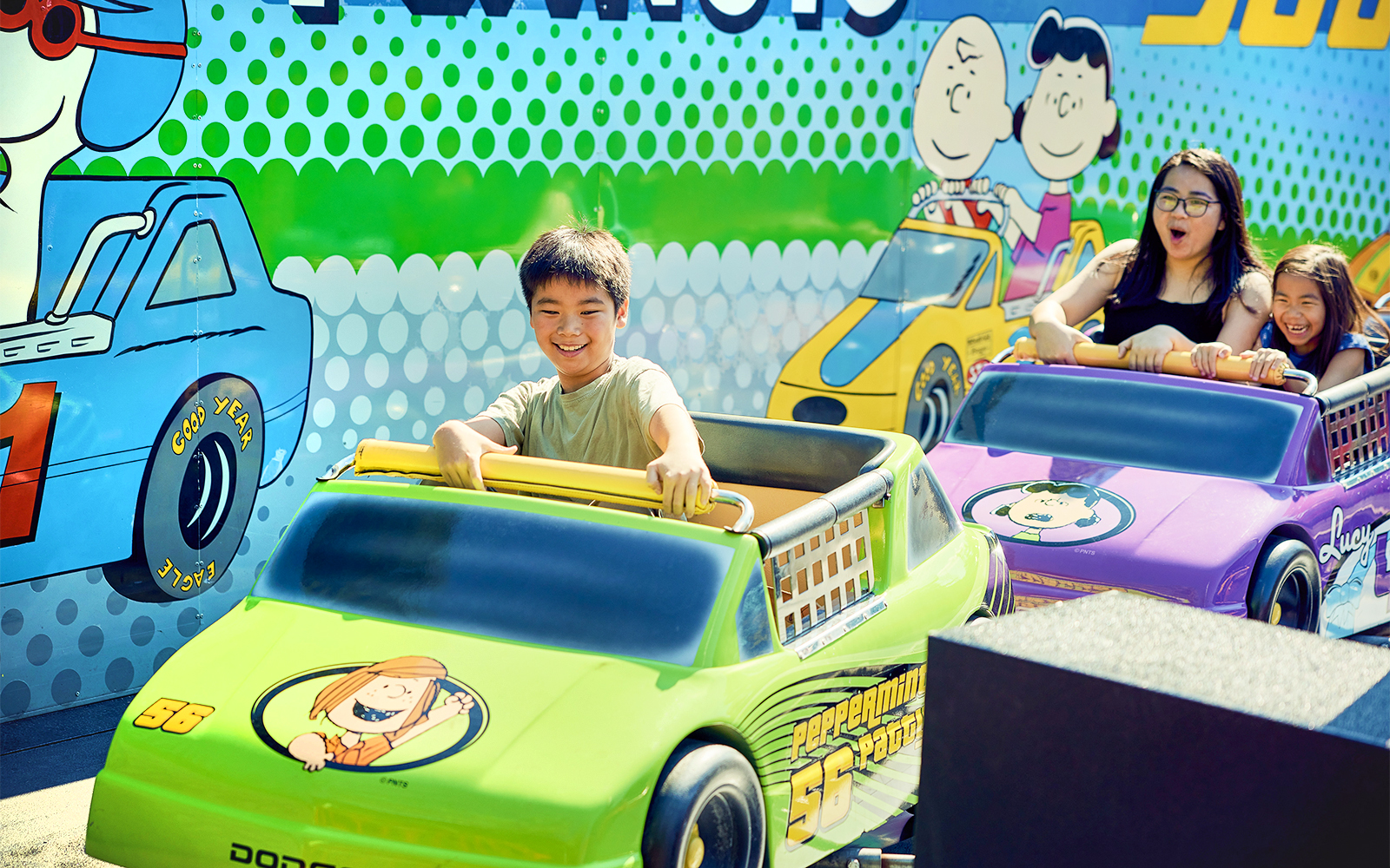 Children enjoying Peanuts-themed ride at Canada's Wonderland.