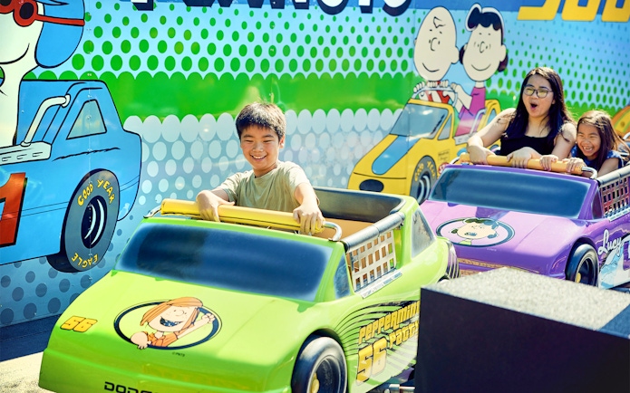 Children enjoying Peanuts-themed ride at Canada's Wonderland.