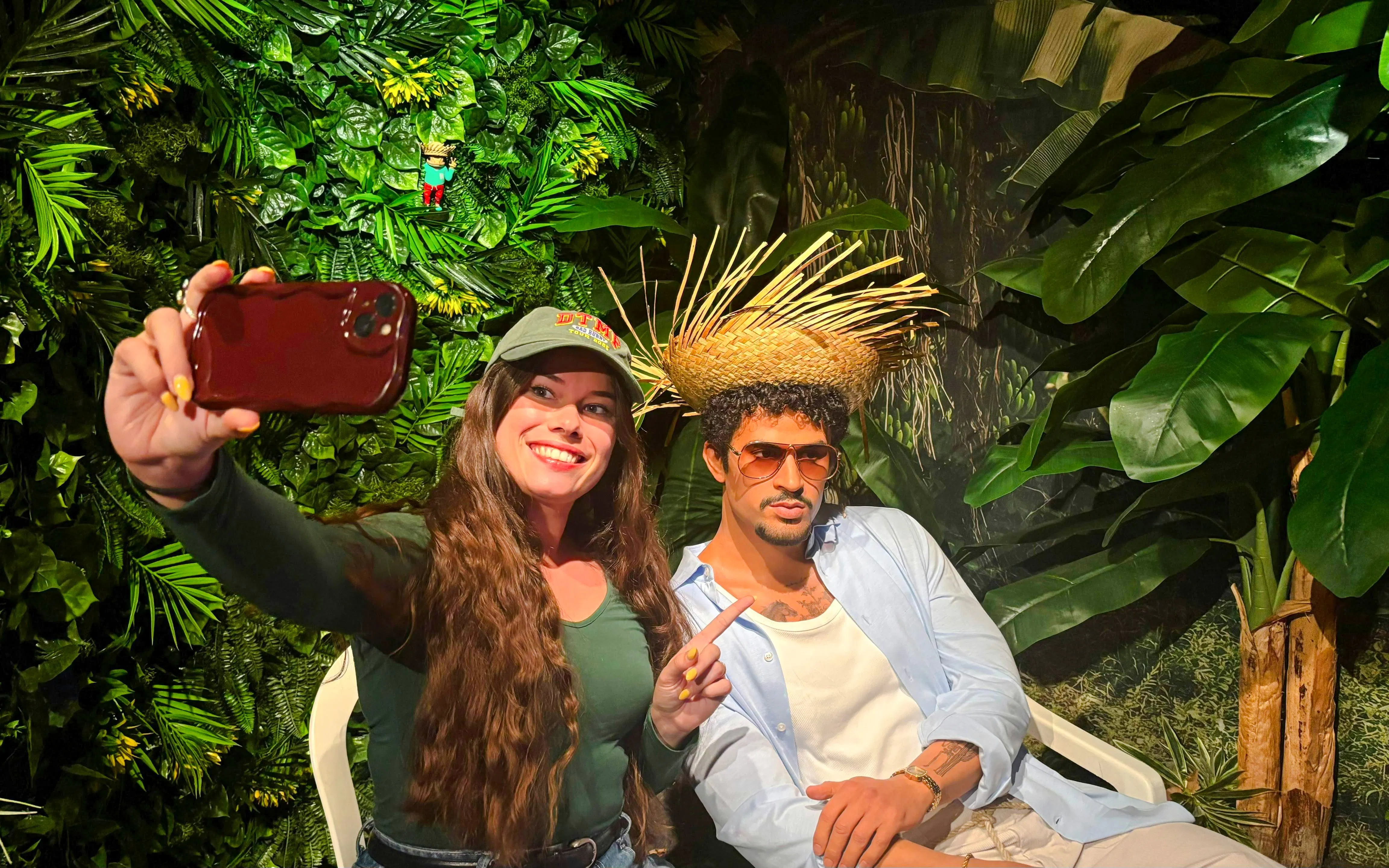 Visitor taking a selfie with a wax figure at Grévin Paris Wax Museum.