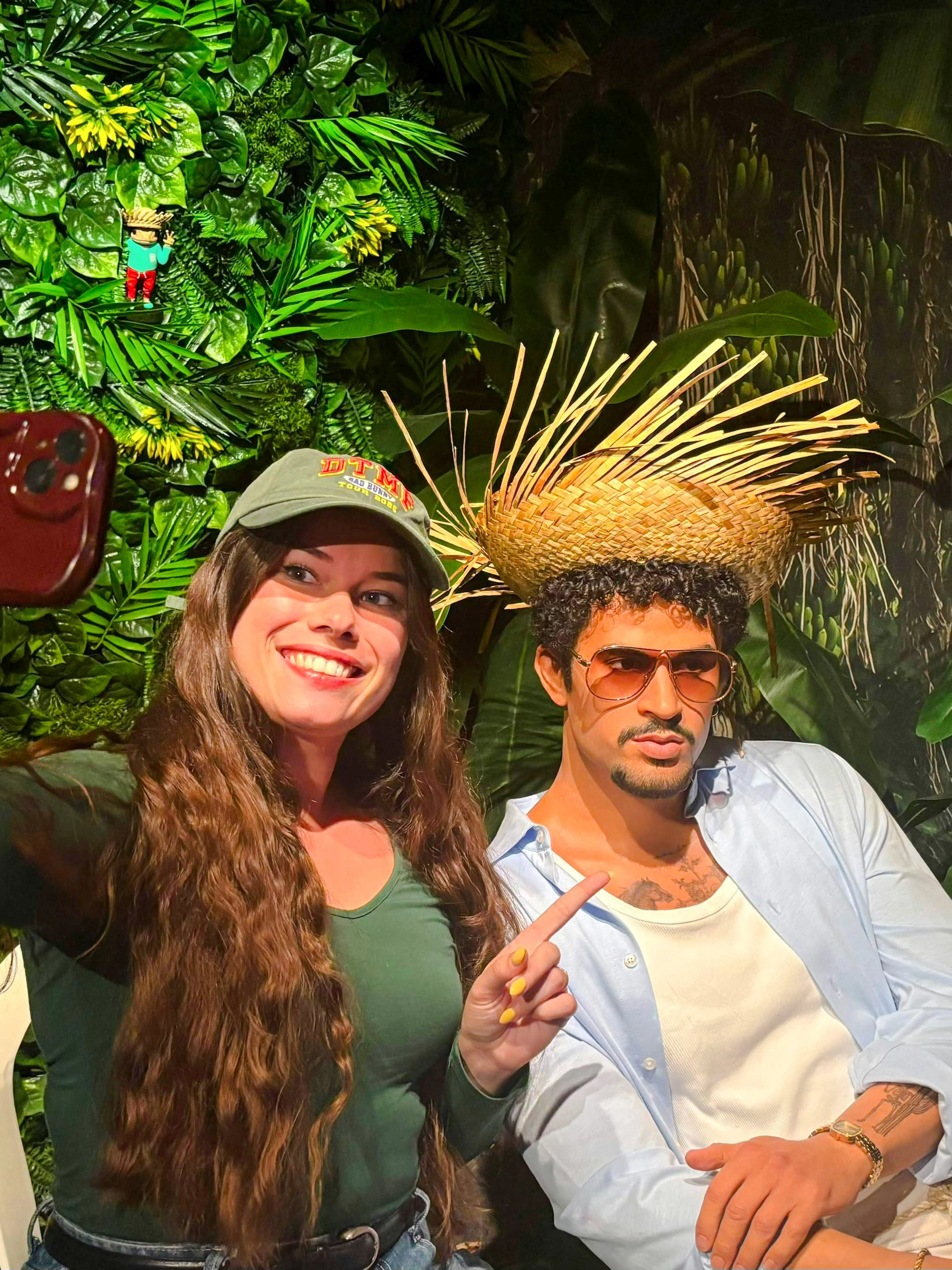Visitor taking a selfie with a wax figure at Grévin Paris Wax Museum.