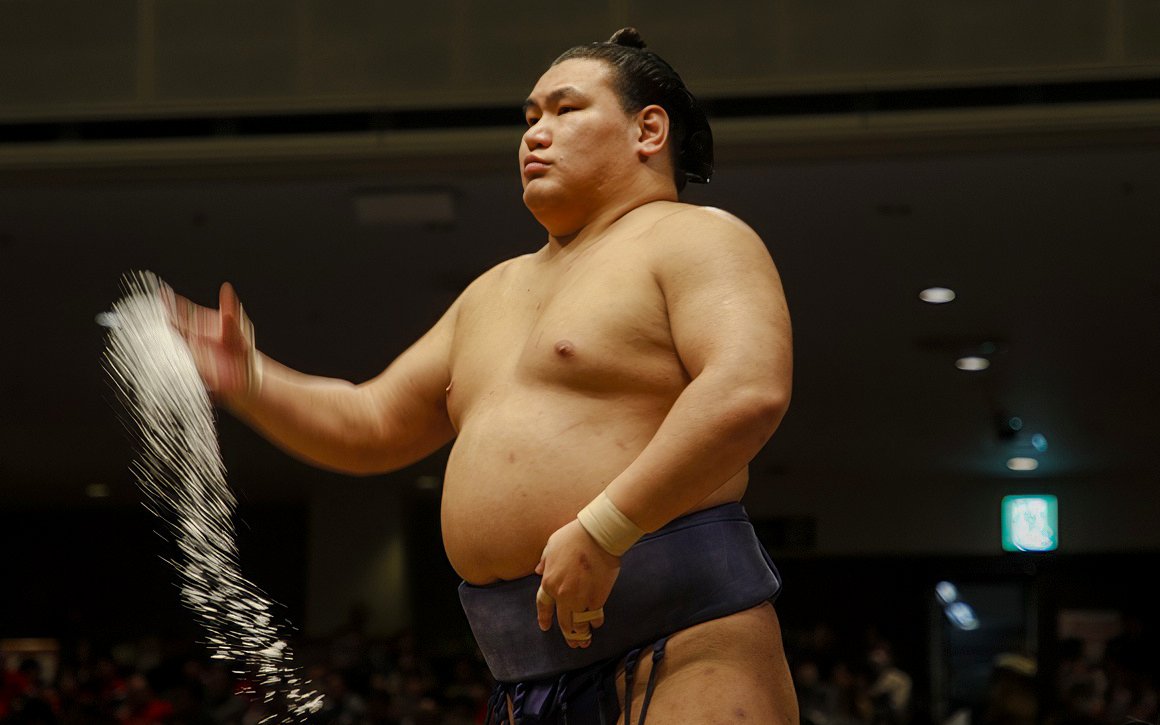 Sumo wrestler performing salt ceremony in Japan.