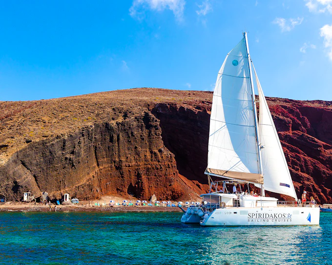 From Santorini: Premium Catamaran Cruise with Meal, Drinks & Transfers