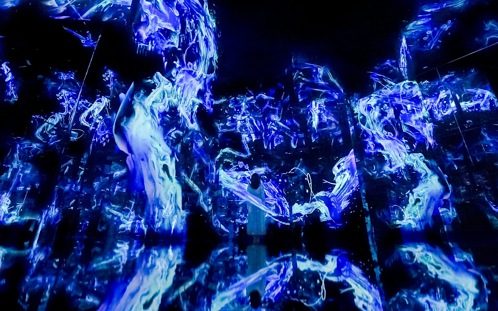 TeamLab Phenomena Abu Dhabi digital art installation with vibrant light displays and interactive elements.
