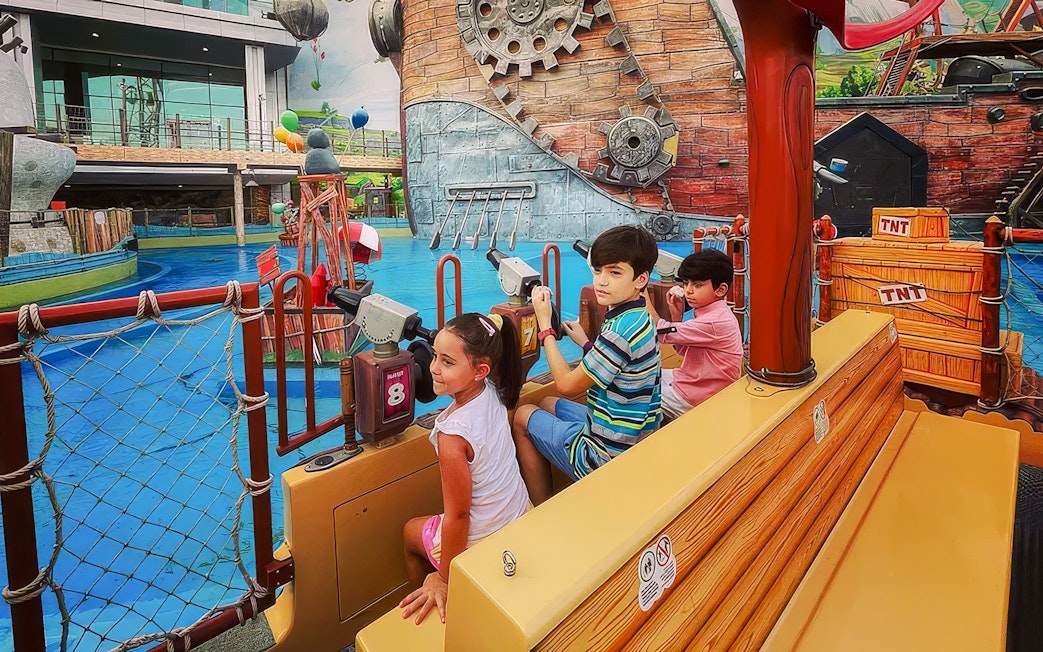 Children on raft battle ride at Angry Birds World Theme Park.