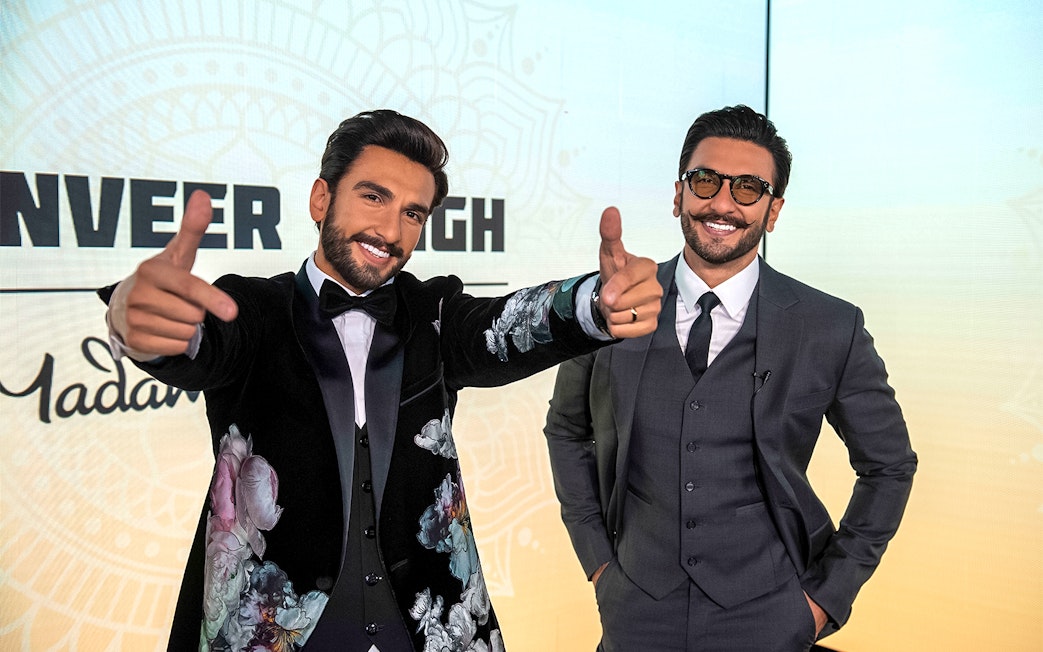 Wax figures at Madame Tussauds Singapore exhibit.