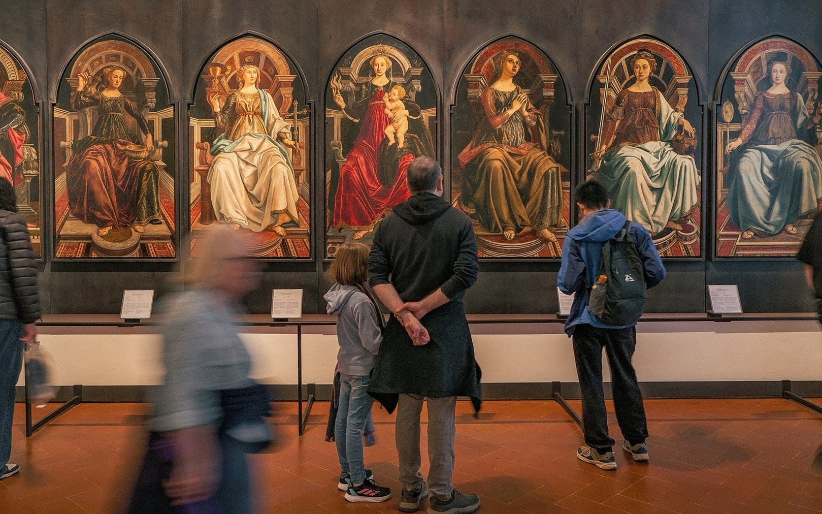 Visitors viewing Renaissance paintings at the Uffizi Gallery, Florence.