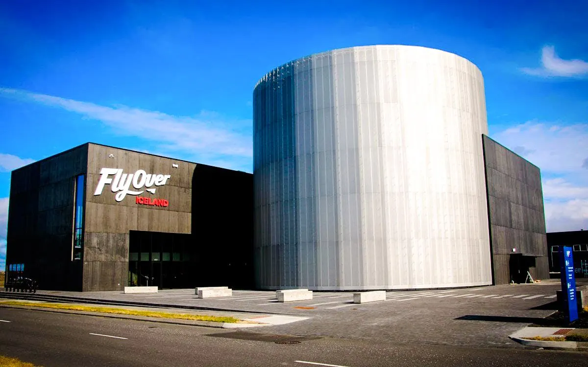 Exterior view of FlyOver Iceland building with cylindrical structure in Reykjavik.