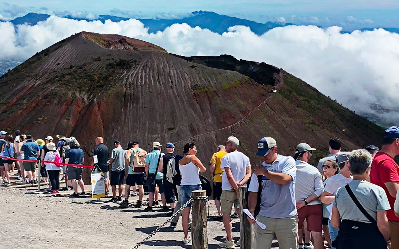 Tourists lining up on Mount Vesuvius during a guided day tour from Naples.