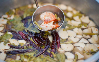 Thai soup with shrimp, mushrooms, and herbs served on a Riverside Carnival Cruise in Bangkok.