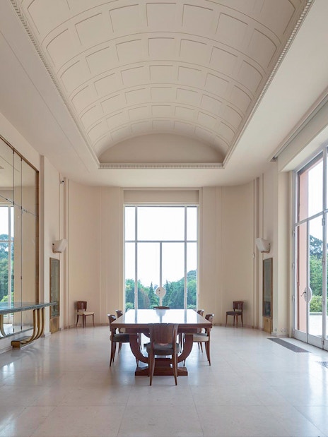 Interior of Serralves Museum with large windows and elegant furniture in Porto, Portugal.