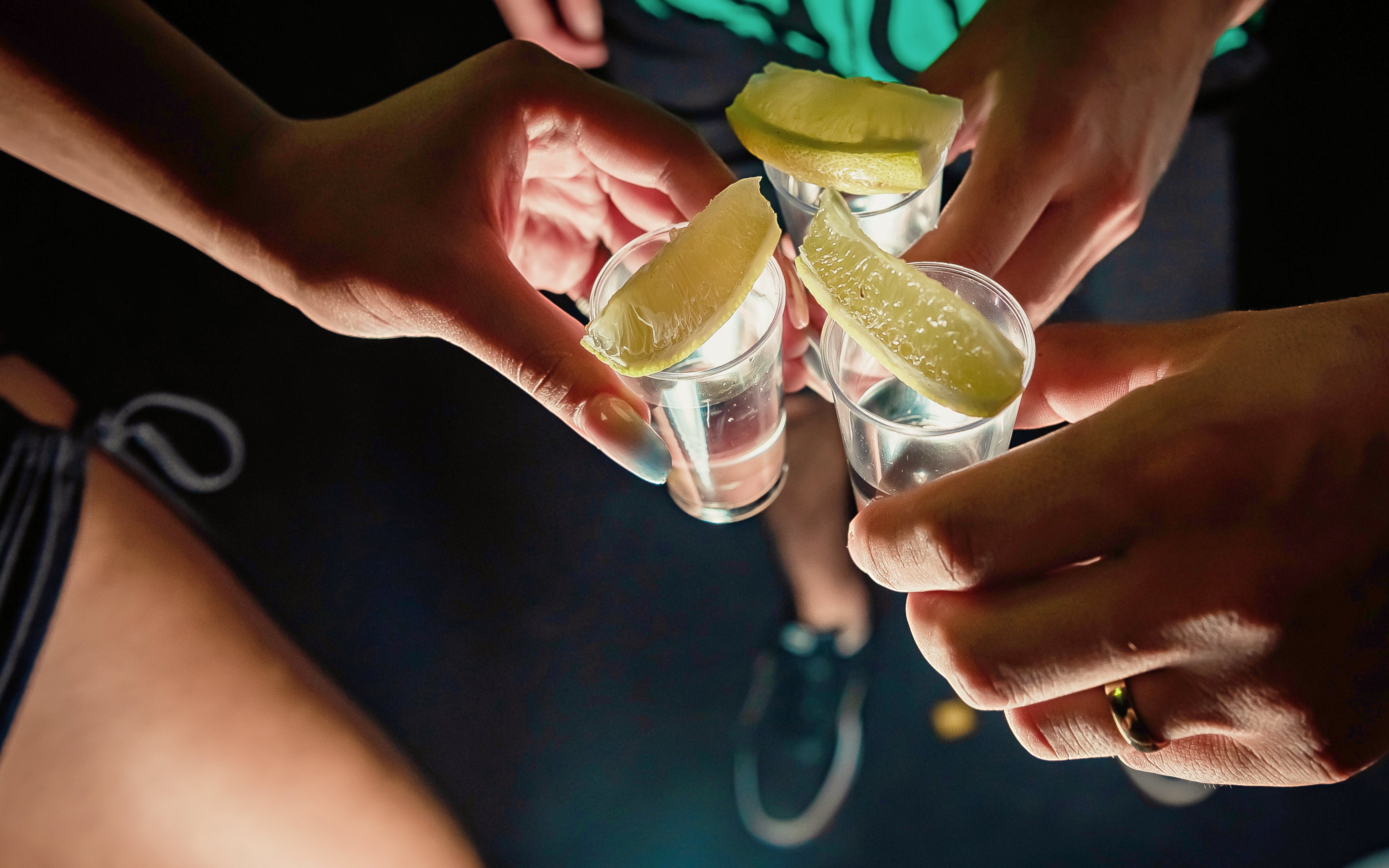 Tequila shots with lime wedges during tasting in Cancun.