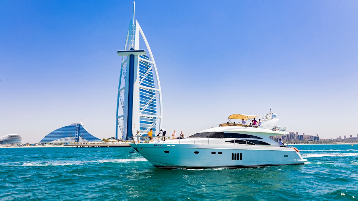 Luxury yacht near Burj Al Arab, Dubai, during a tour with live BBQ and drinks.