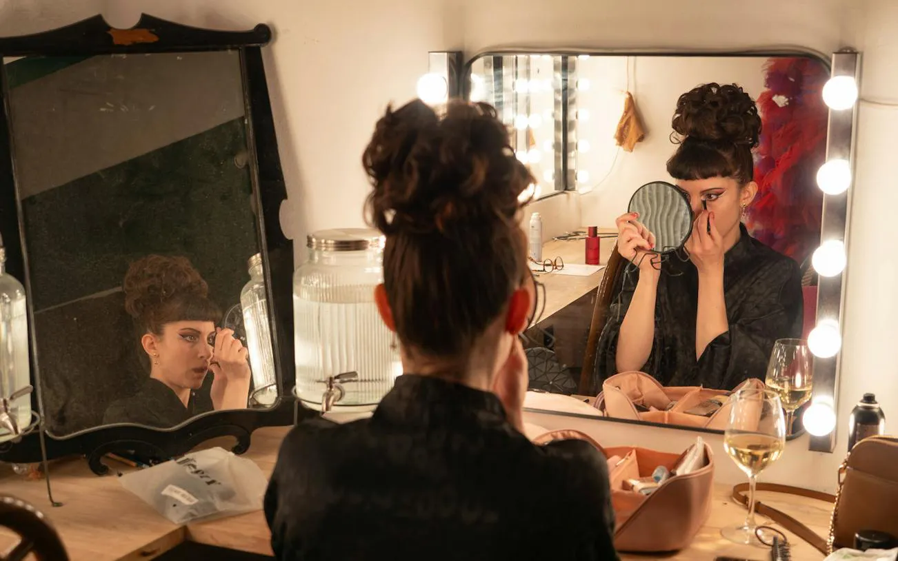Performer preparing makeup backstage for Ellington Club Burlesque Show, Rome.