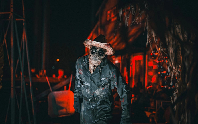 Haunted character in costume at Knott's Berry Scary Farm, Southern California.