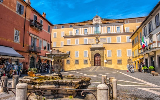 Facade of Castel Gandolfo with fountain in Rome, Italy.