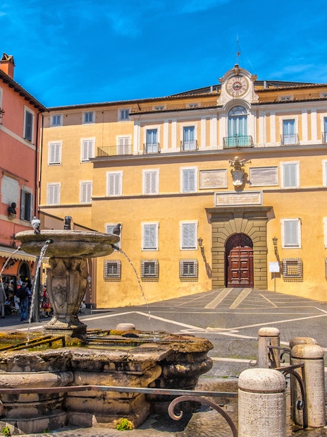 Facade of Castel Gandolfo with fountain in Rome, Italy.