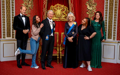 Wax figures of King Charles III and Queen Camilla at Madame Tussauds, part of Harry Potter Studio Tour combo.