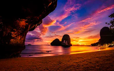 Railay Beach sunset with limestone cliffs, Krabi, Thailand.