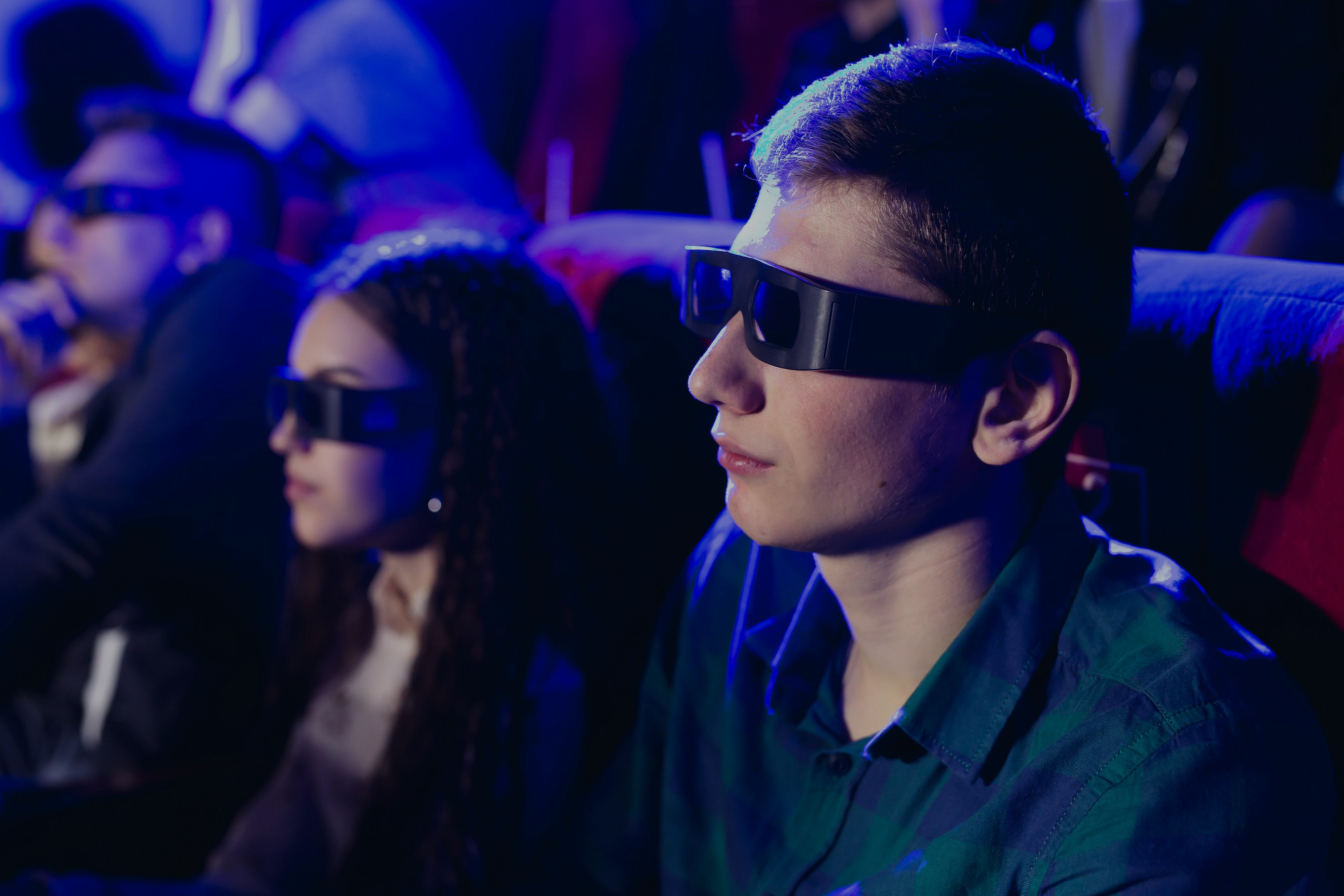 Man wearing 3D glasses at London Eye 4D cinema.