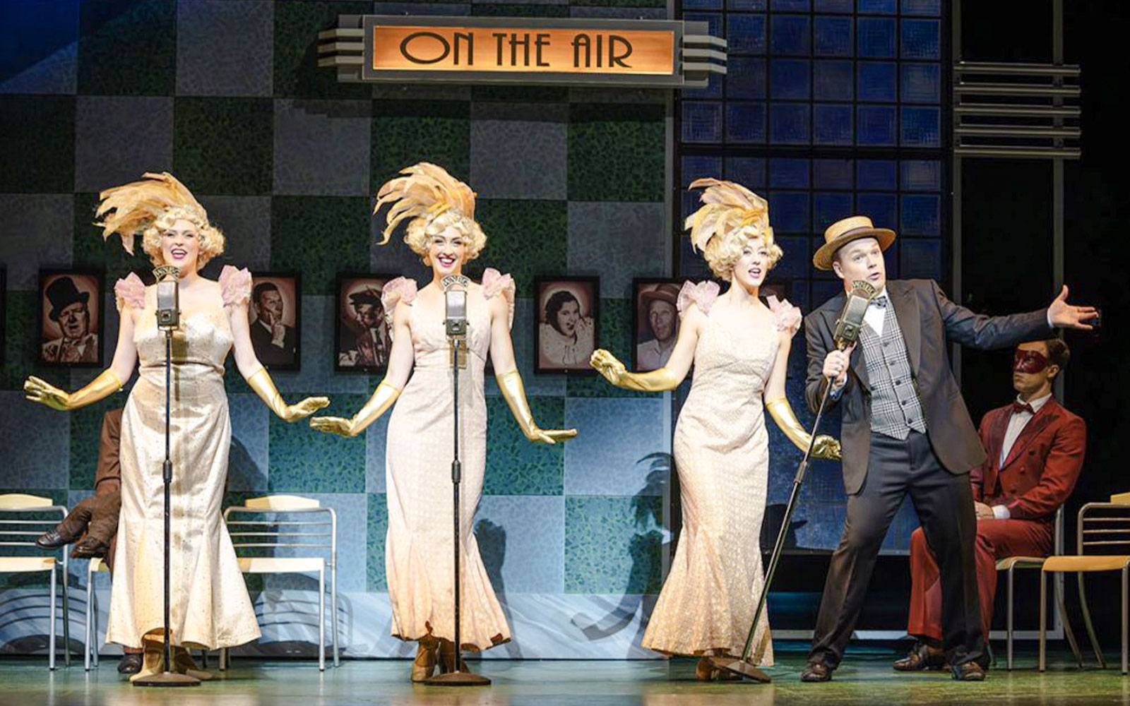 Performers in 1930s attire singing into vintage microphones during an Annie show.