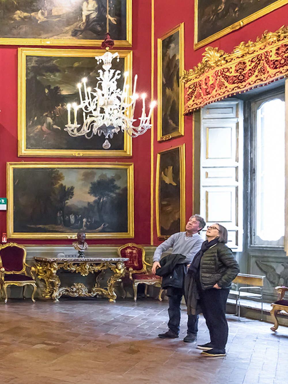 Visitors admiring art in the Doria Pamphilj Gallery, Rome.