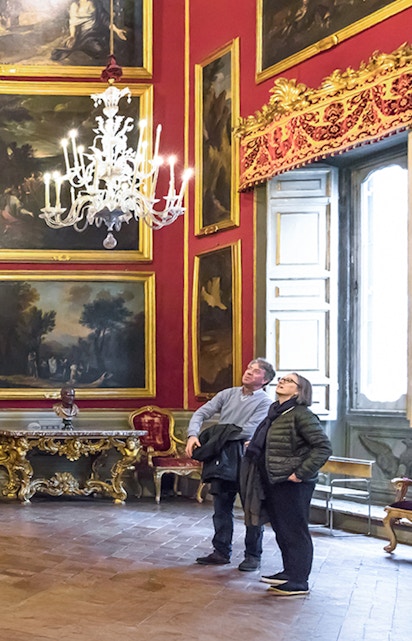 Visitors admiring art in the Doria Pamphilj Gallery, Rome.