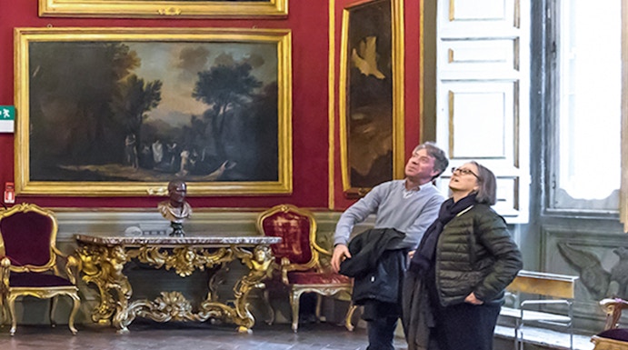 Visitors admiring art in the Doria Pamphilj Gallery, Rome.