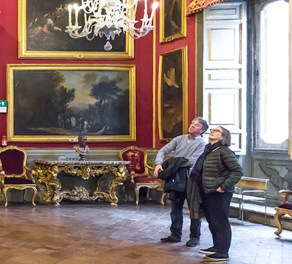 Visitors admiring art in the Doria Pamphilj Gallery, Rome.