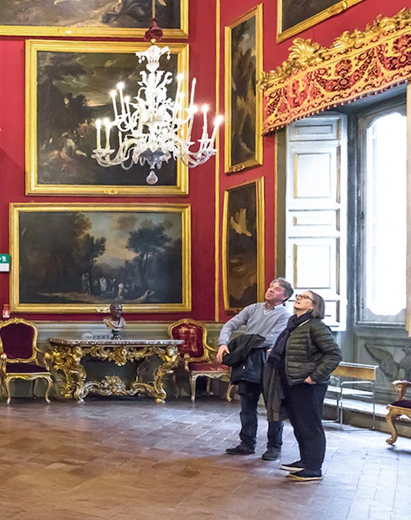 Visitors admiring art in the Doria Pamphilj Gallery, Rome.