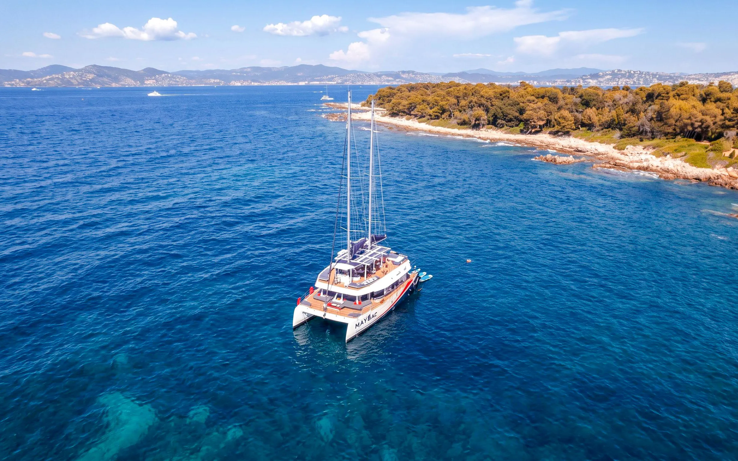 Catamaran cruising near Lérins Island in Marina Bay of Angels.