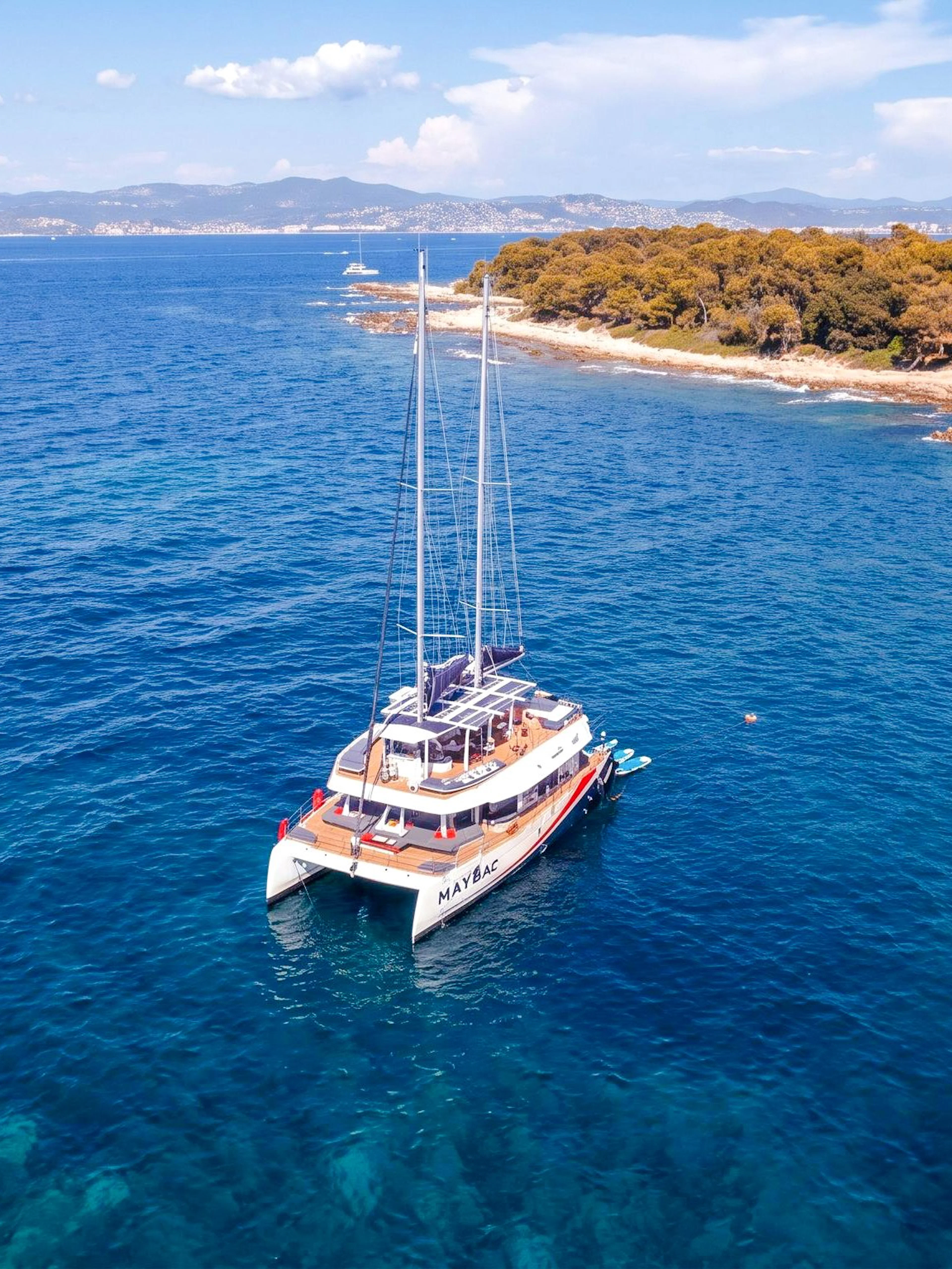 Catamaran cruising near Lérins Island in Marina Bay of Angels.