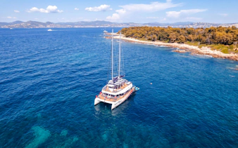 Catamaran cruising near Lérins Island in Marina Bay of Angels.
