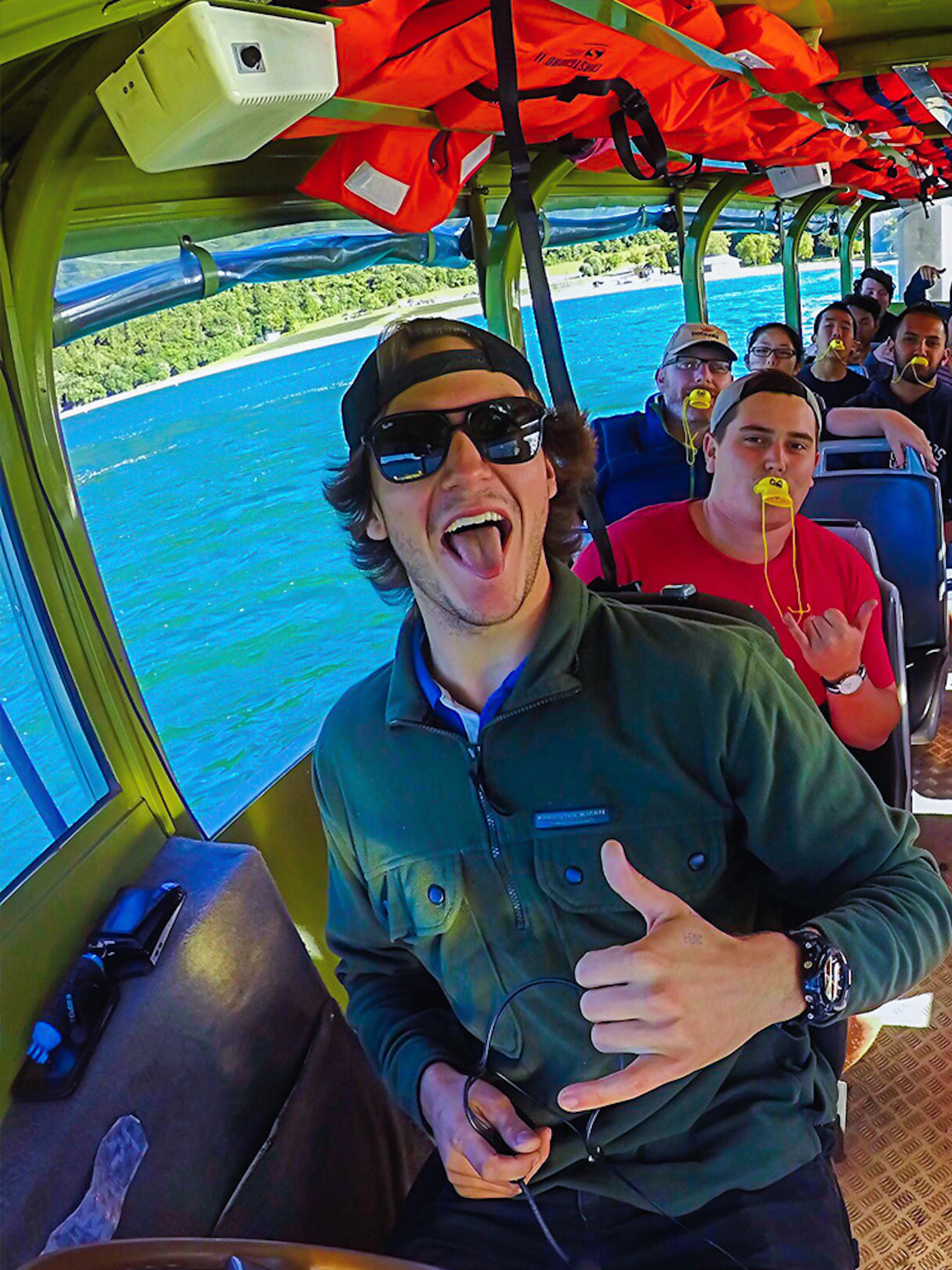 Tour group enjoying a Rotorua City and Lakes amphibious vehicle ride.