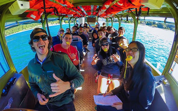Tour group enjoying a Rotorua City and Lakes amphibious vehicle ride.