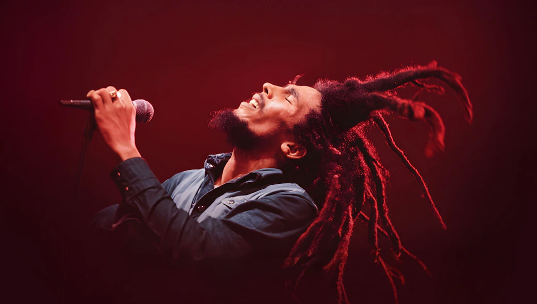 Performer singing at Bob Marley The Show, Vegas stage.
