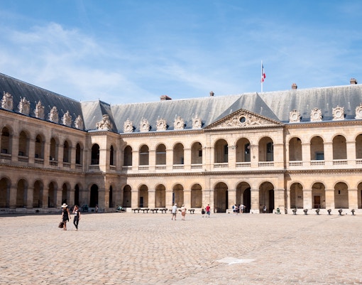 Paris Army Museum exterior with cannons and French flags