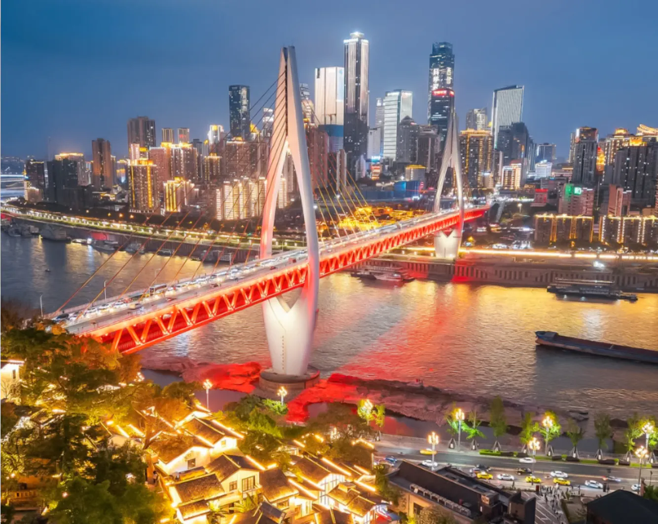 Chongqing skyline with illuminated bridge over Yangtze River at night.