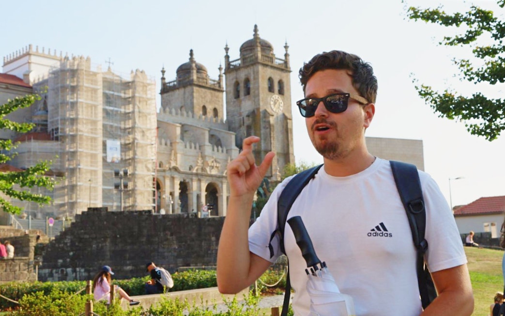 Tourist guide explaining Porto Cathedral in Porto, Portugal.