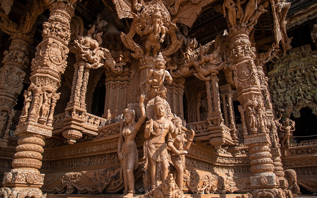Intricate wooden carvings at The Sanctuary of Truth in Pattaya, Thailand.