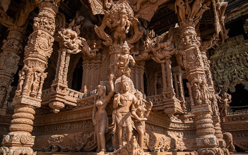 Intricate wooden carvings at The Sanctuary of Truth in Pattaya, Thailand.