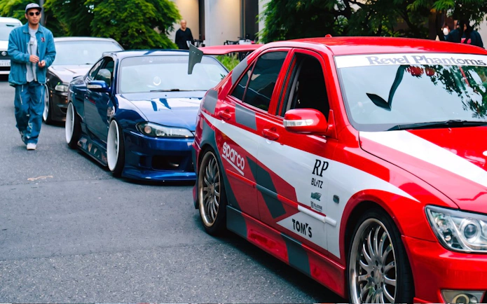 Tokyo sports car meet featuring modified vehicles at Daikoku PA.