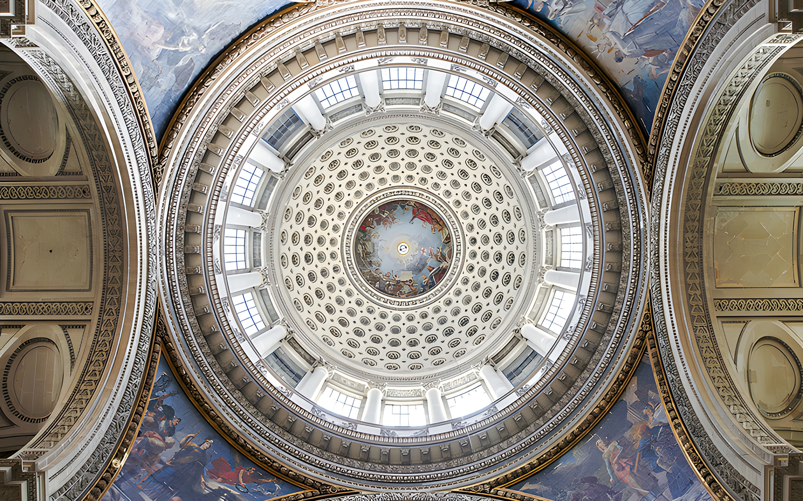 Dome interior of the Paris Pantheon with intricate frescoes and architectural details.