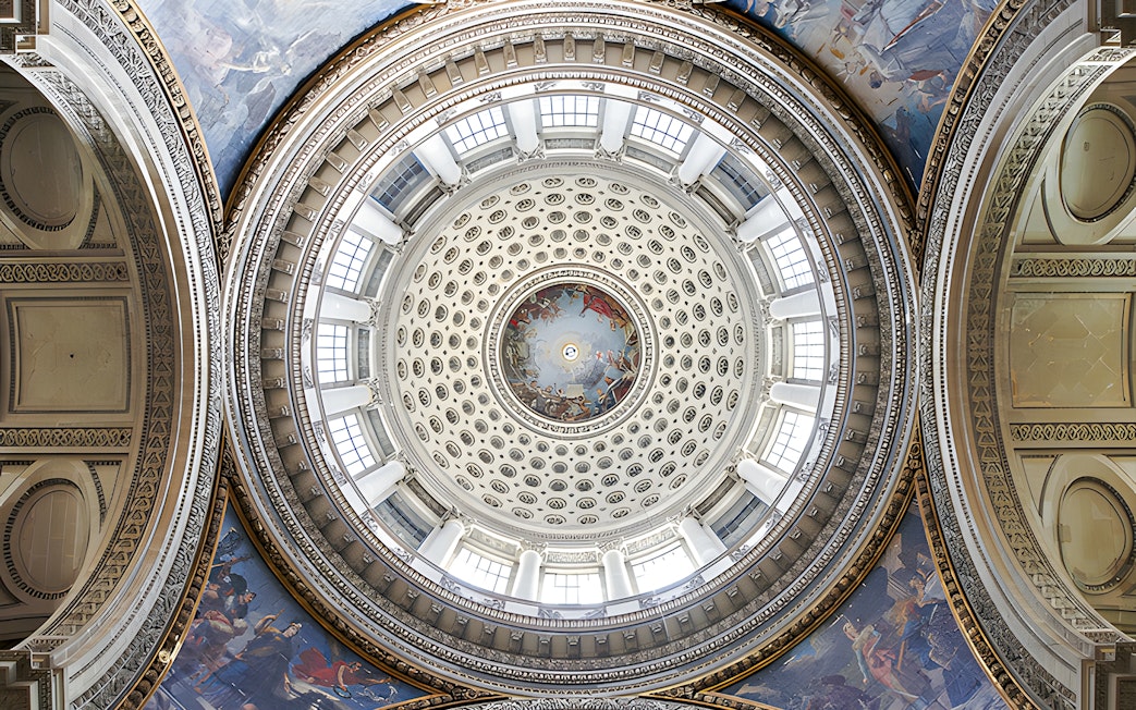 Dome interior of the Paris Pantheon with intricate frescoes and architectural details.