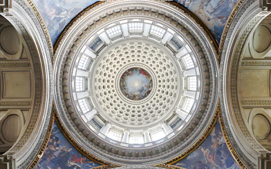 Dome interior of the Paris Pantheon with intricate frescoes and architectural details.