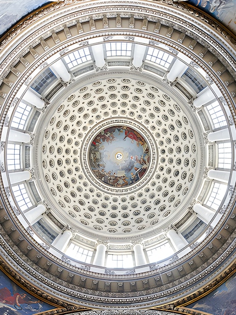 Dome interior of the Paris Pantheon with intricate frescoes and architectural details.