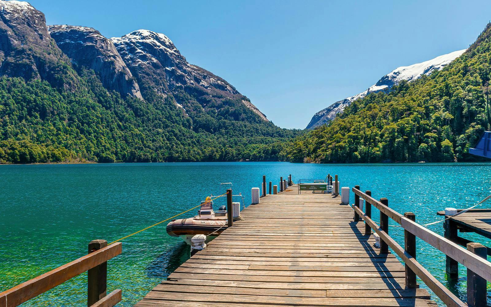 Wooden pier extending into turquoise waters at Puerto Blest, Nahuel Huapi National Park.