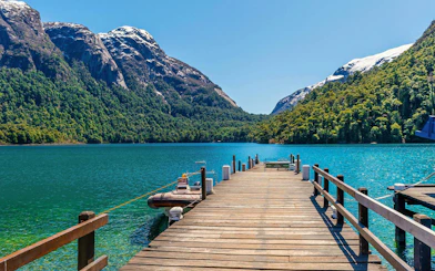 Wooden pier extending into turquoise waters at Puerto Blest, Nahuel Huapi National Park.