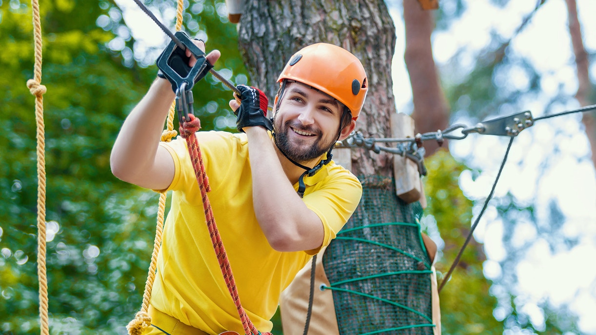 Man enjoying a zipline adventure at Montes de Laboreiro.